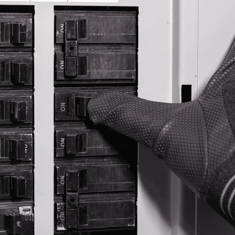 Circuit breaker panel with a tripped breaker in the middle position